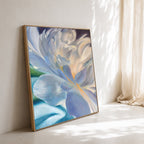 Framed abstract floral painting by Eva Cassini with blue and white colors on a light surface.