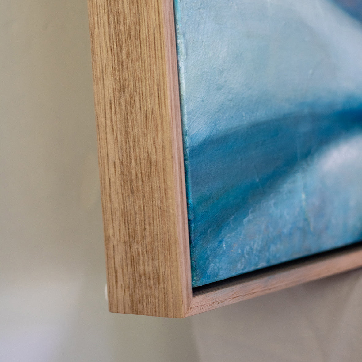 Detail of natural wood float frame and original abstract floral painting by Eva Cassini