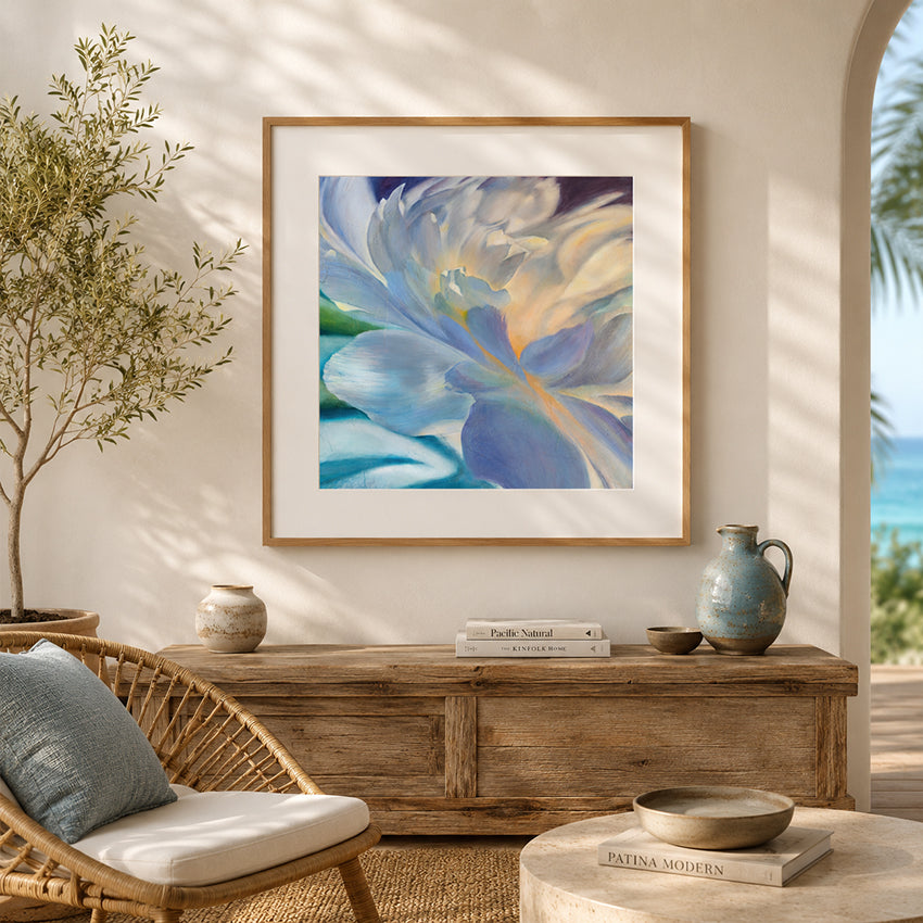 Framed abstract floral artwork by eva cassini on a wall in a coastal living room