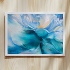 Framed fine art print of a blue and white abstract flower by Eva Cassini