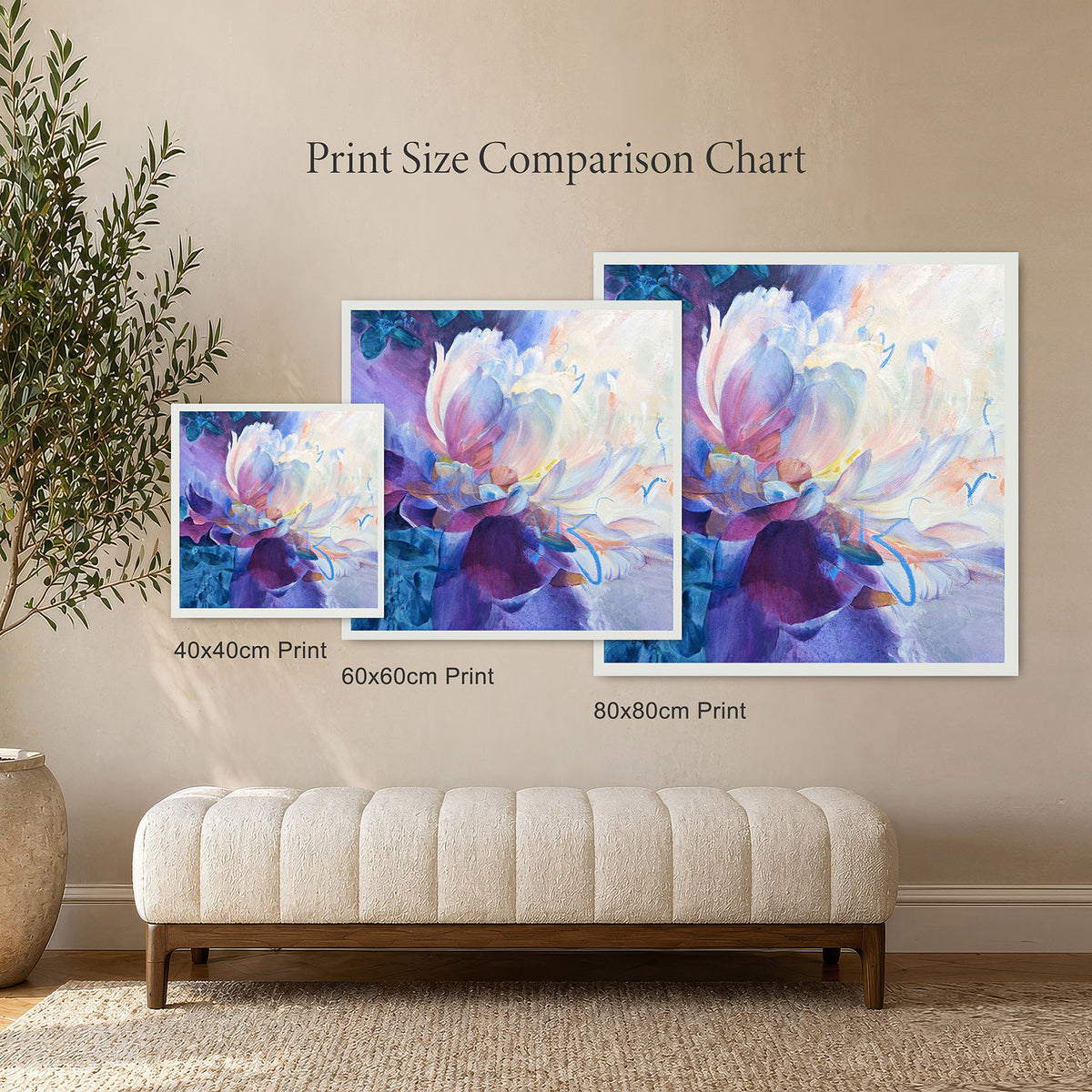 Three floral art prints of different sizes on a wall with a bench and plant.