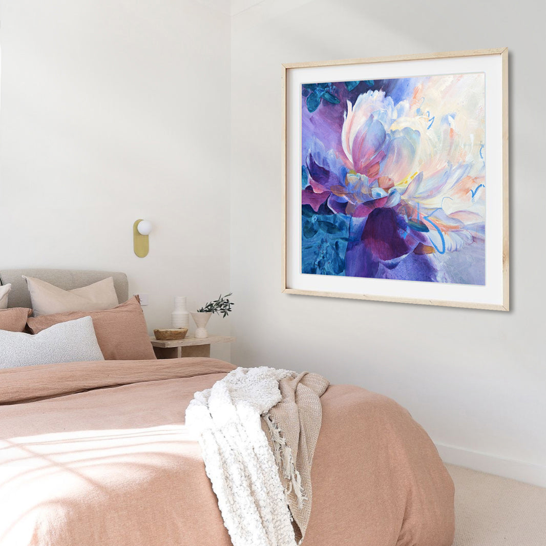 Colorful abstract fine art print framed on a wall in a contemporary bedroom