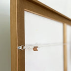 Detail of back of framed artwork showing hanging harware and professional craftsmanship